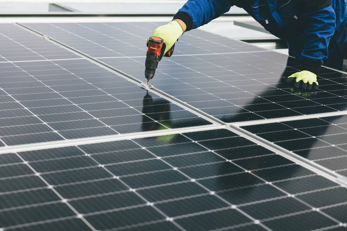 Close-up of properly installed mc4 solar cable connectors linking two photovoltaic panels